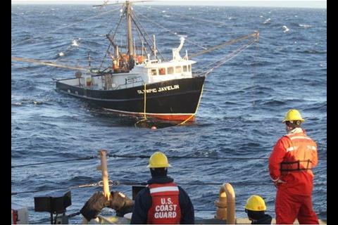 Coast Guard crew preparing to tow a disabled fishing vessel